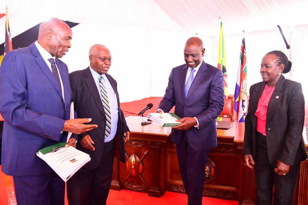File image of President Ruto receiving a report from the  Presidential Working Party on Education Reforms